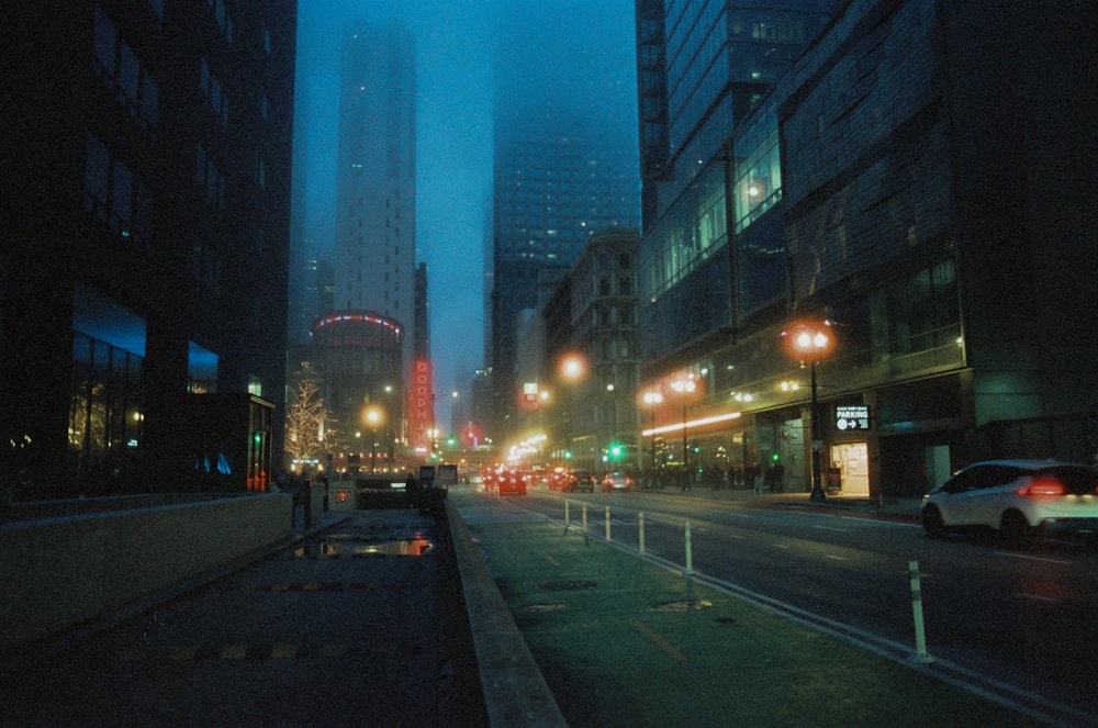 a city street filled with lots of traffic at night