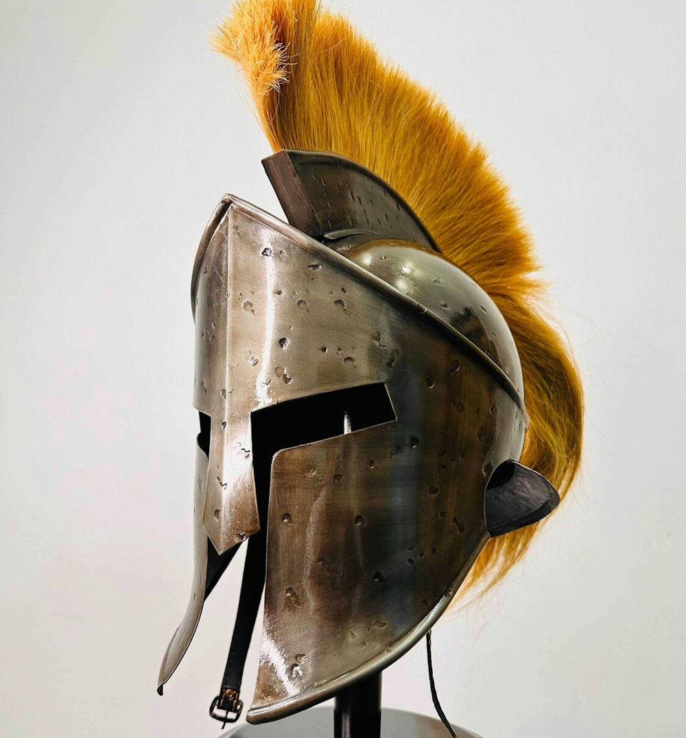 a helmet with a yellow mohawk on top of it