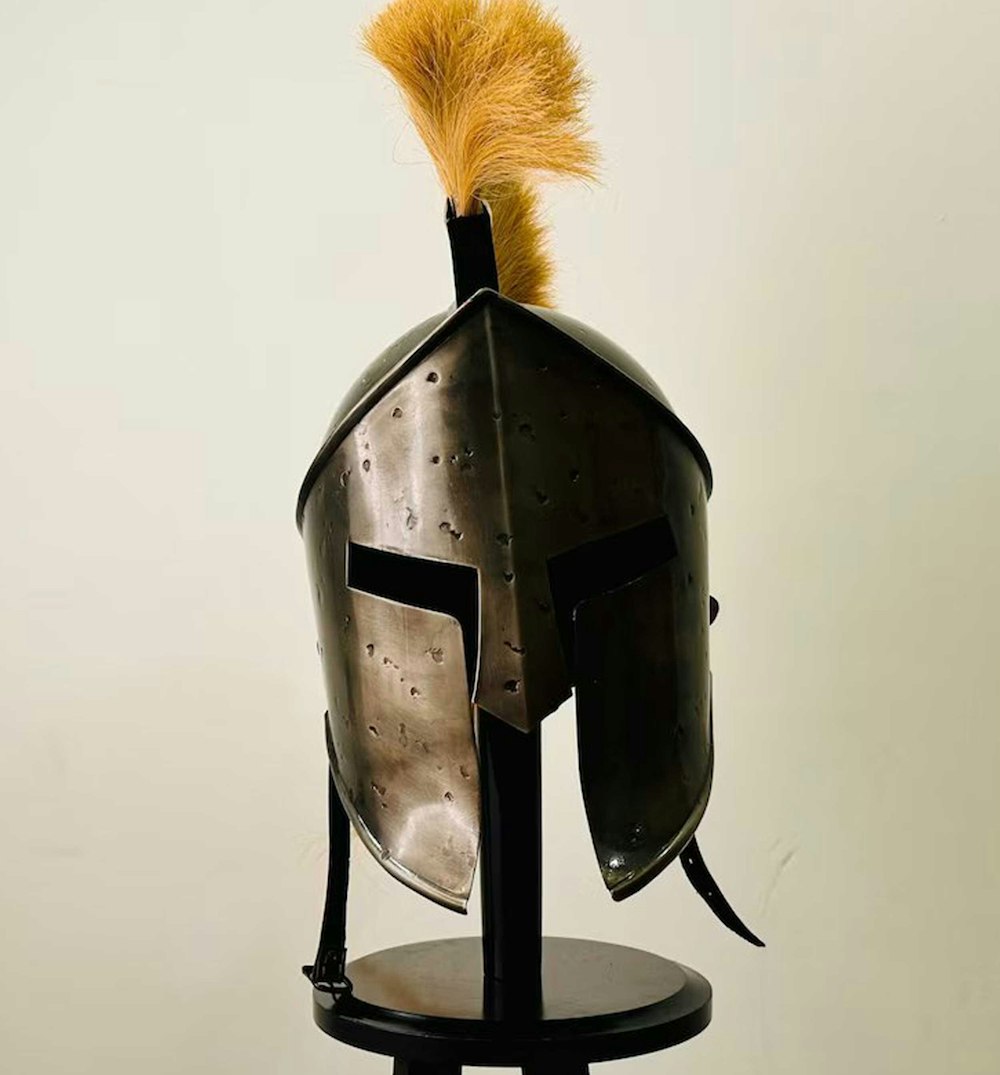 a helmet with a yellow mohawk on top of it