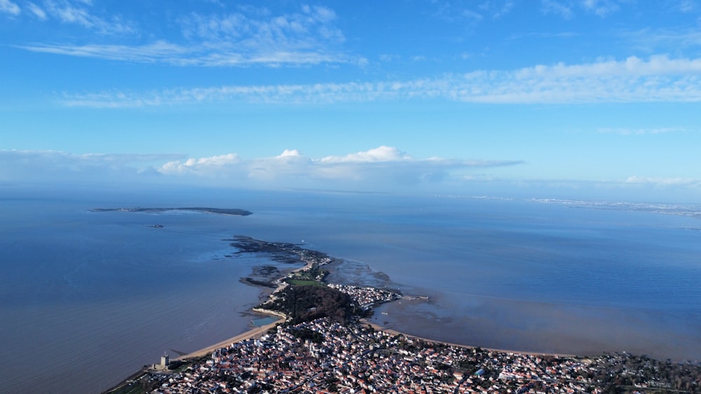 an aerial view of a city by the ocean