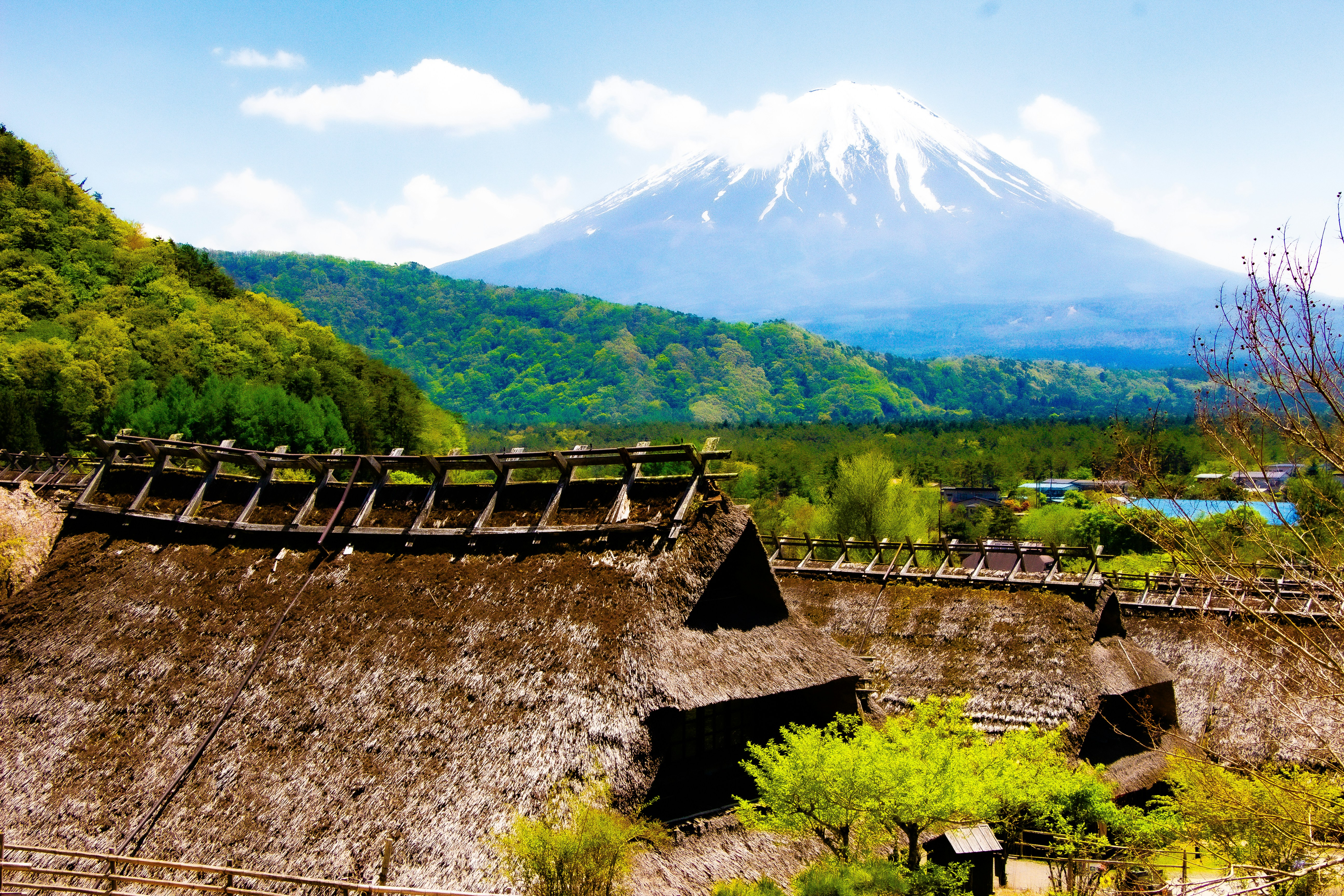 a view of a mountain with a house in the foreground