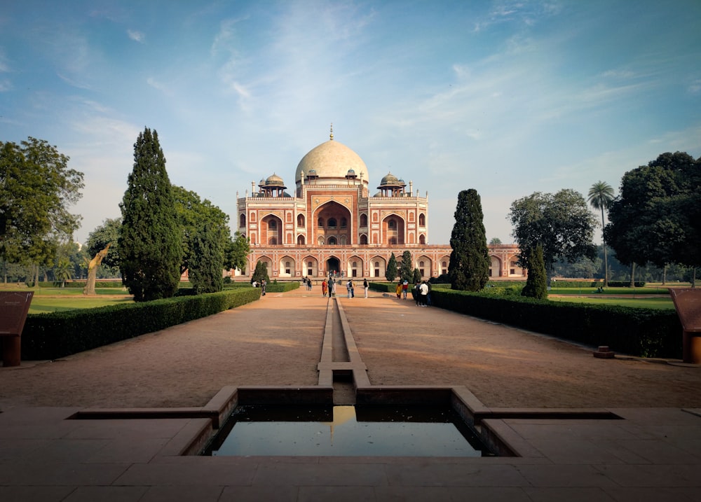 a large building with a fountain in front of it