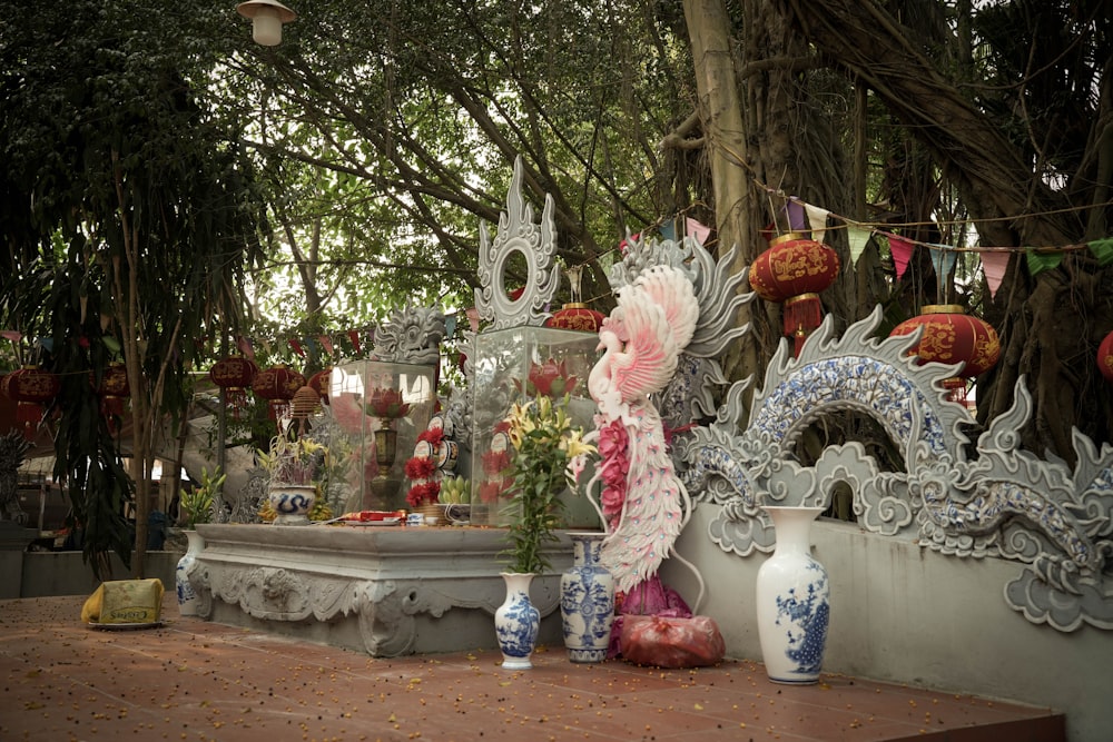 a table topped with vases filled with flowers