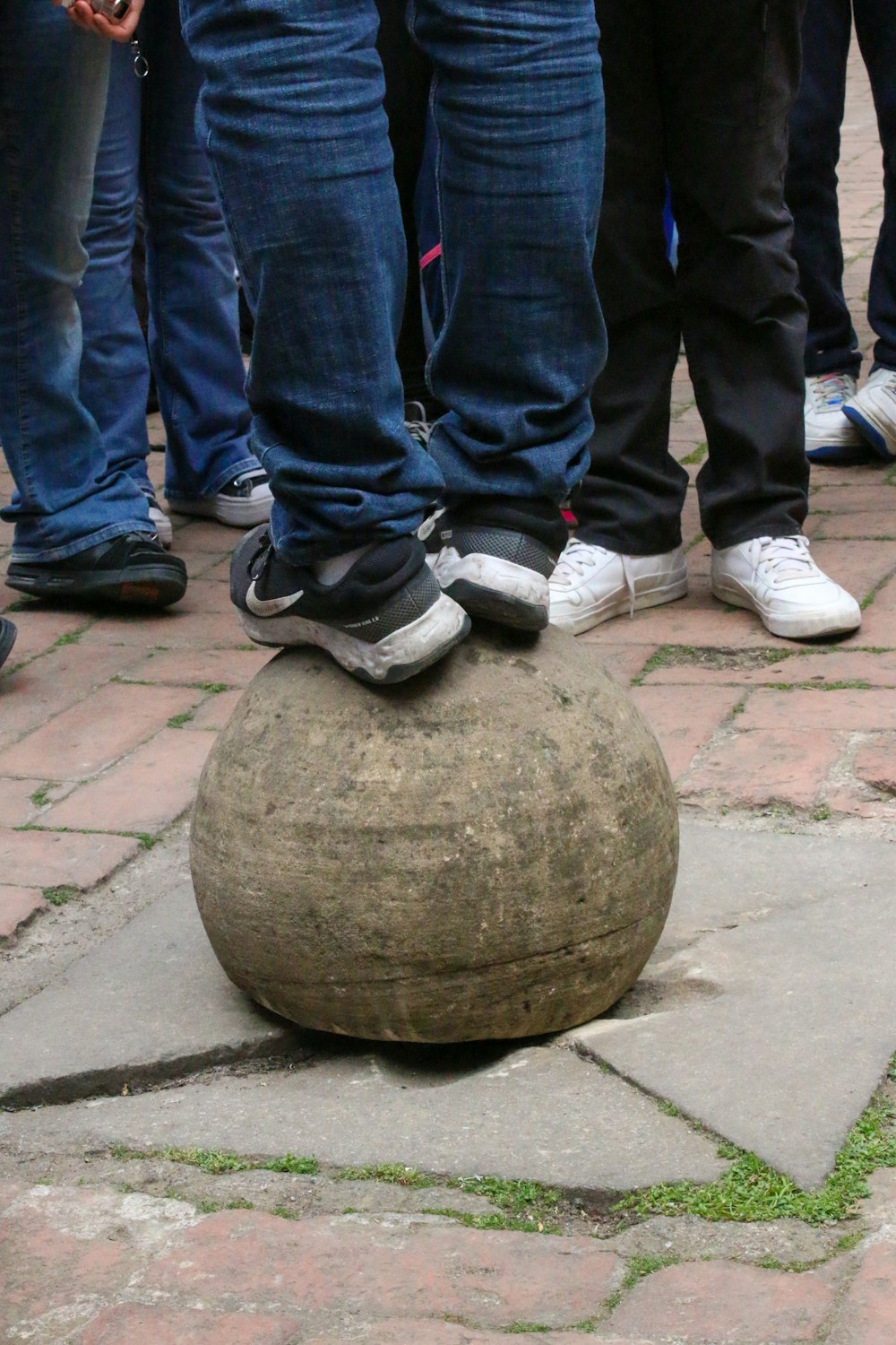 a group of people standing on top of a rock