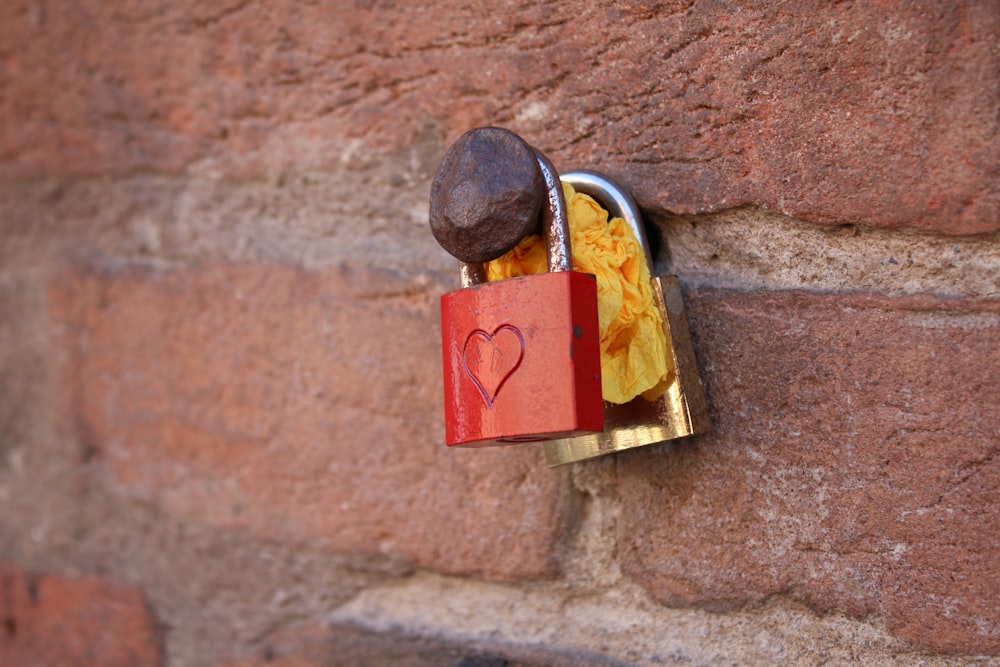 a brick wall with a lock and a heart on it