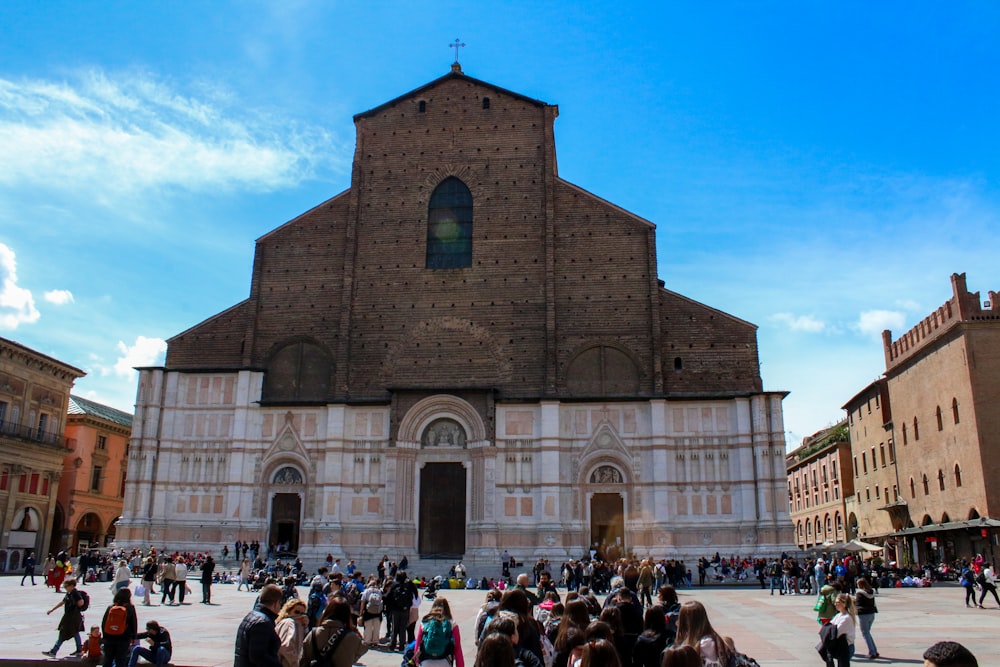 a group of people standing in front of a church