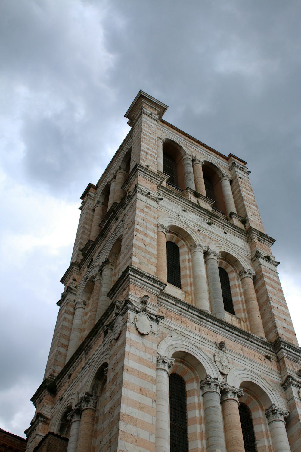 a very tall tower with a clock on it's side