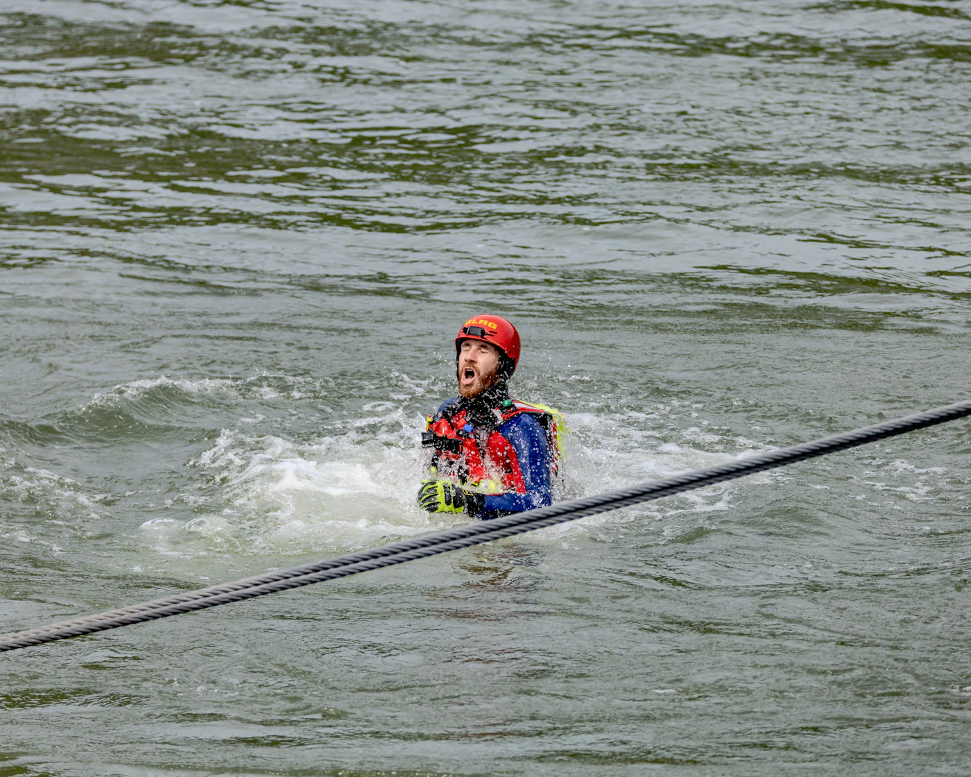 Water sports participant wearing a life jacket and protective gloves