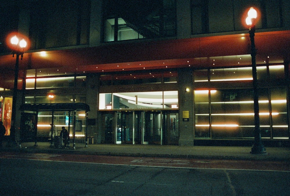 a building with a lit up entrance at night