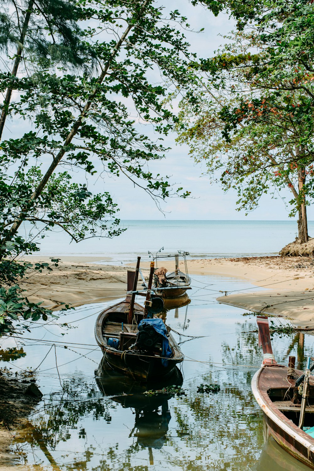 a couple of boats that are sitting in the water