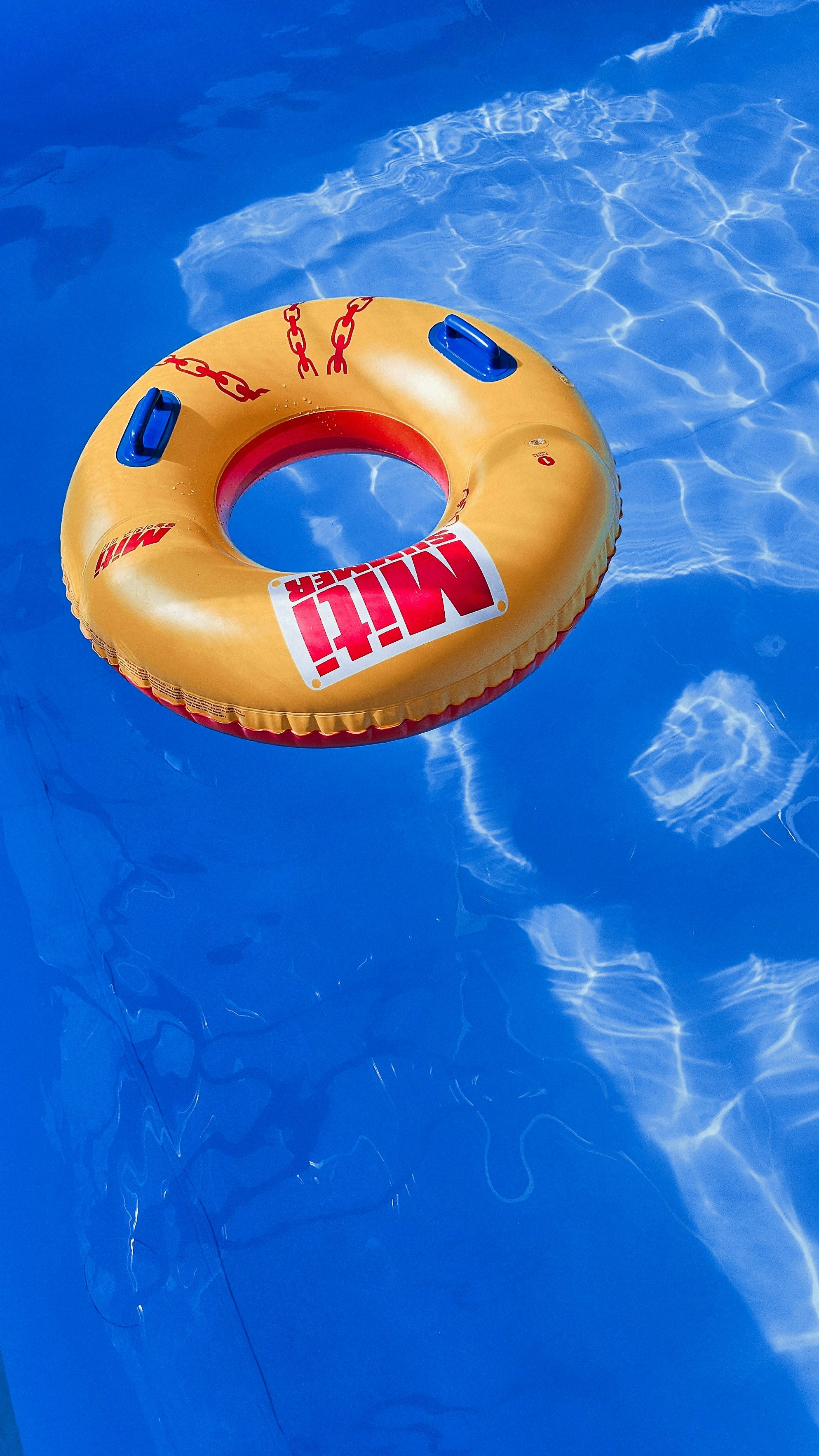 an inflatable ring floating in a pool of water