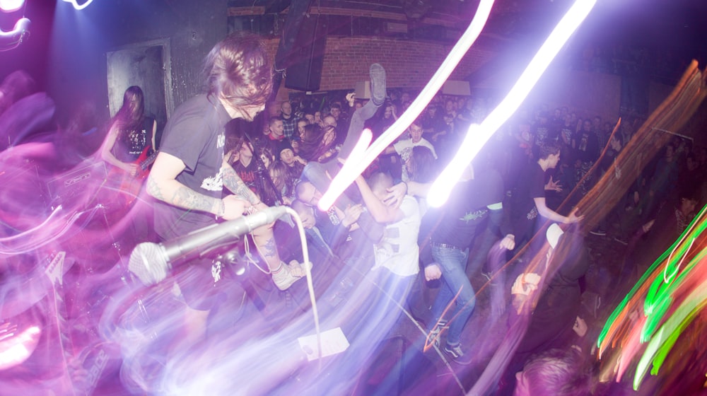 a group of people dancing in a club