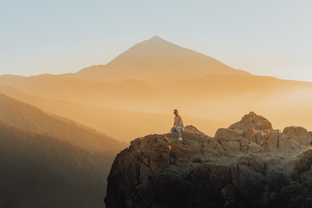 a person standing on top of a mountain