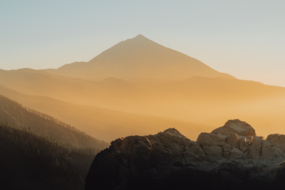 a view of a mountain range at sunset