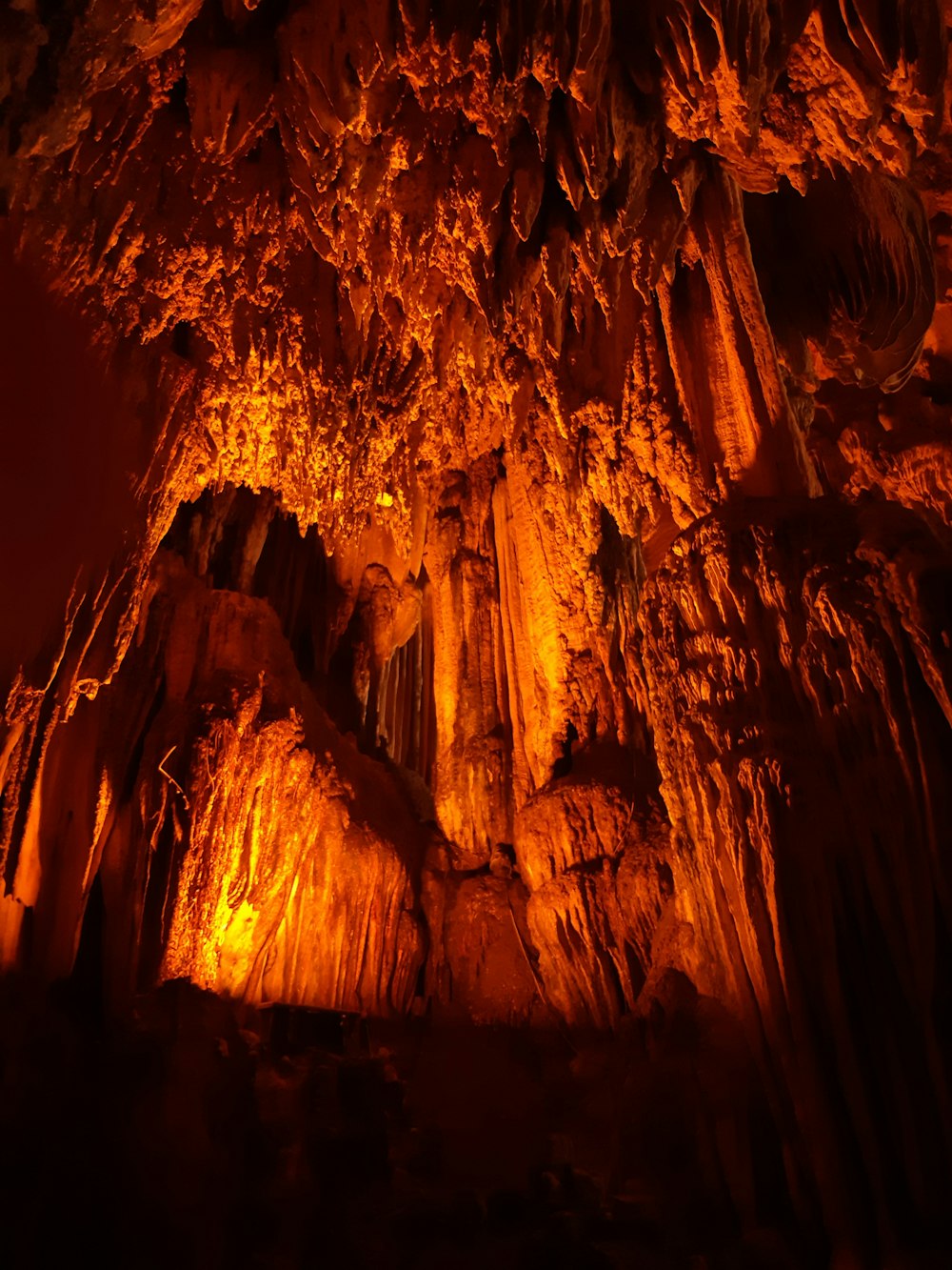 a cave filled with lots of tall rocks