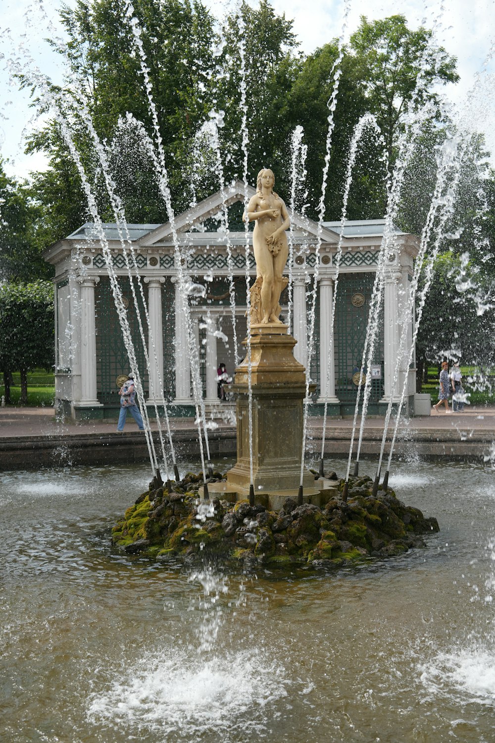 a fountain with a statue on top of it