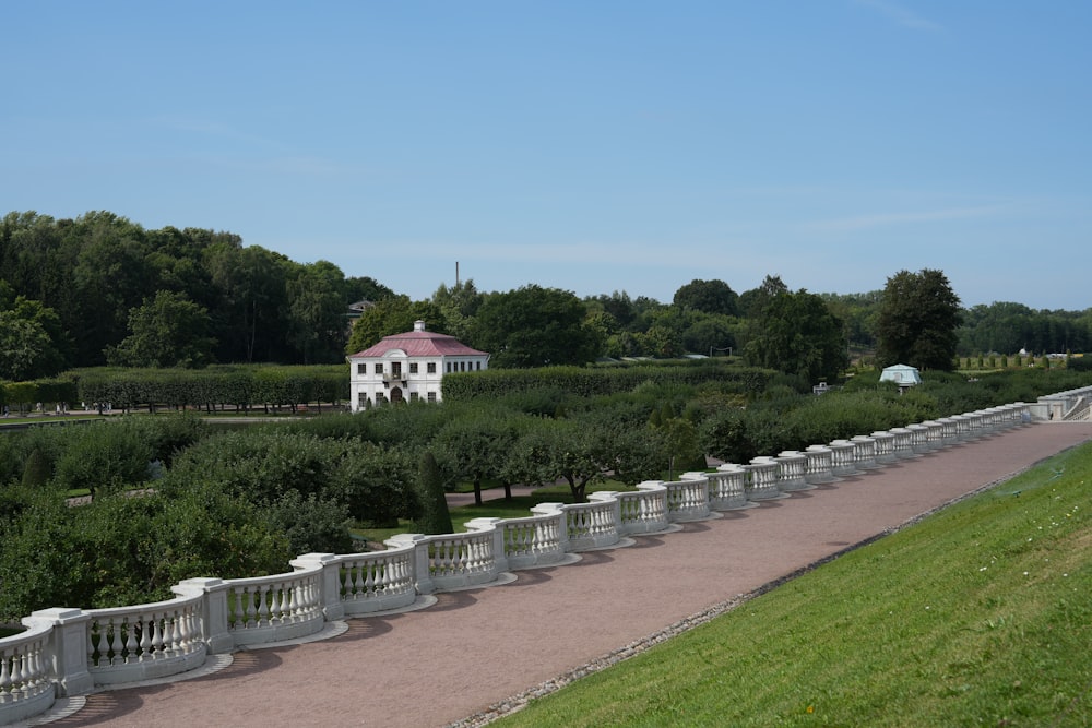 a white house in the middle of a park