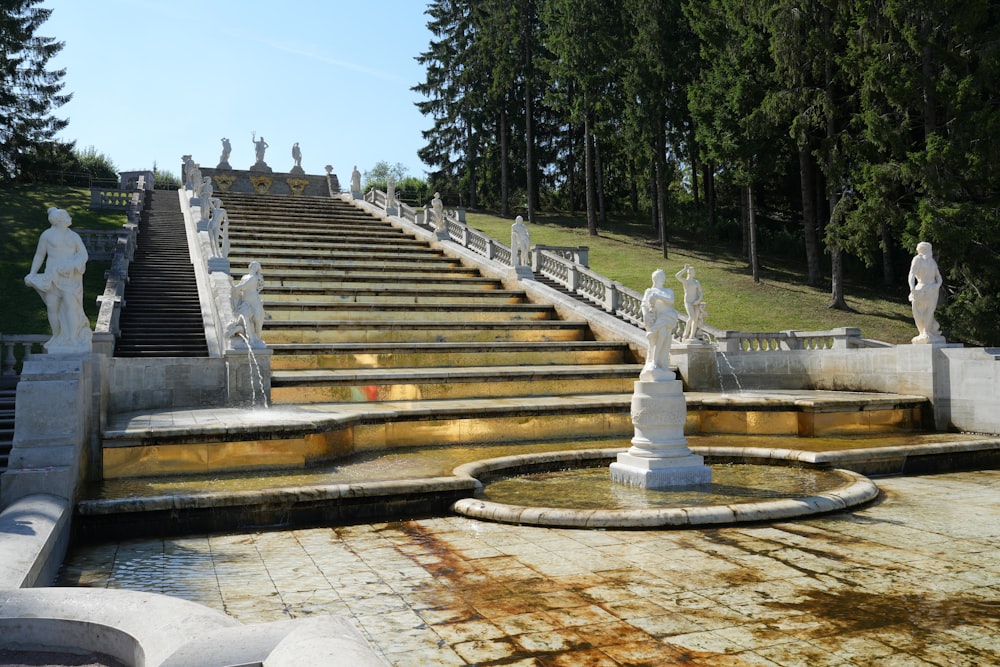 a large set of stairs with statues on each of them