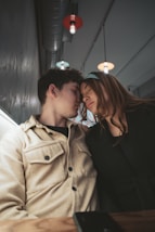a man and a woman sitting next to each other