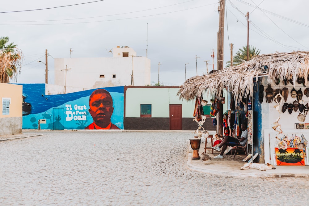 a street scene with a store on the side of the road