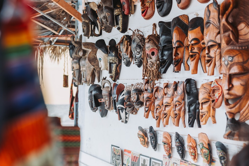 a wall with a bunch of shoes hanging on it