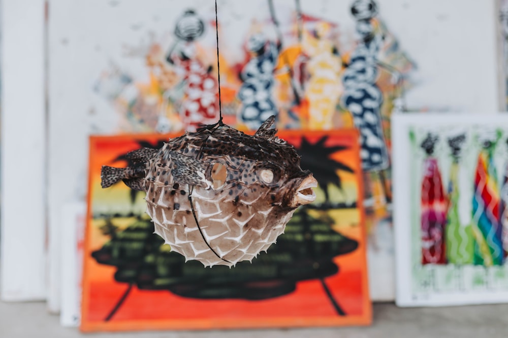 a close up of a bird on a string