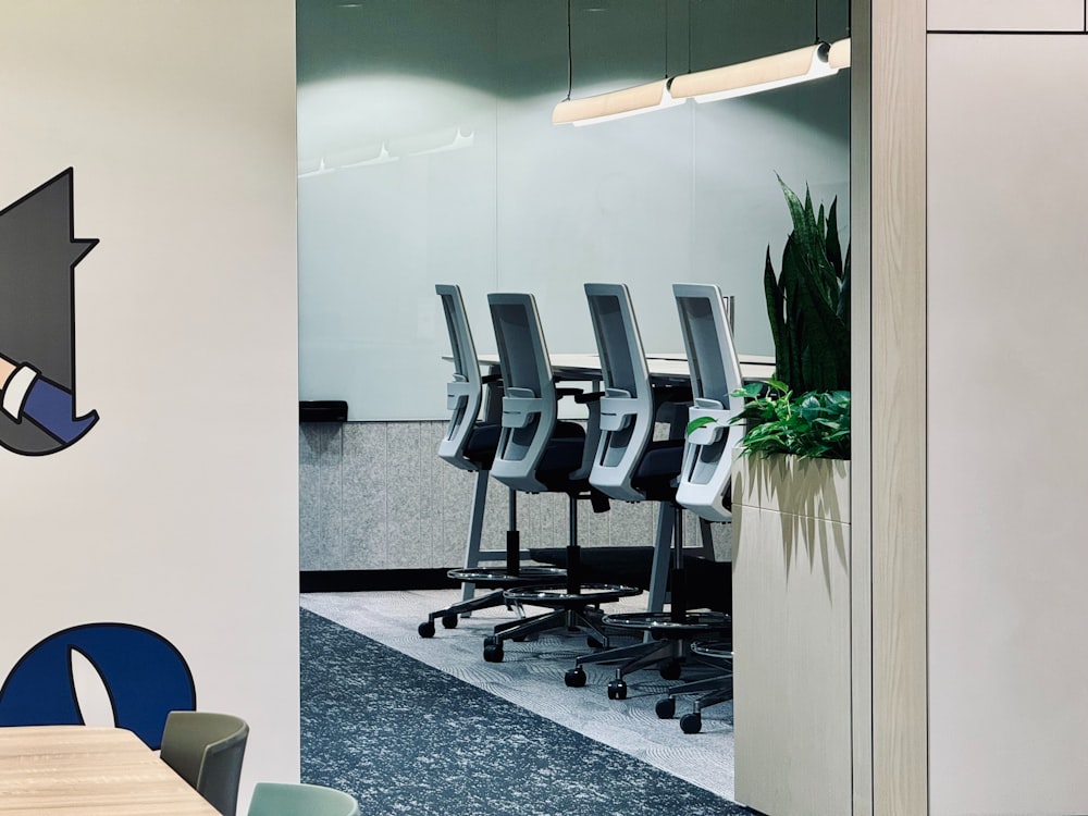 a conference room with chairs and a clock on the wall