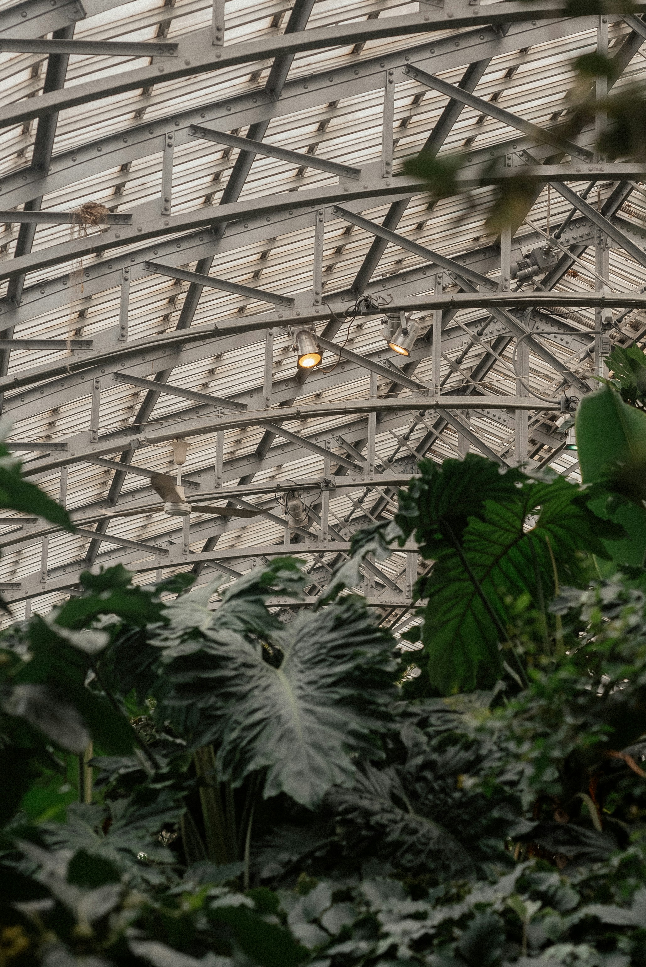 a large metal structure with a clock on the side of it