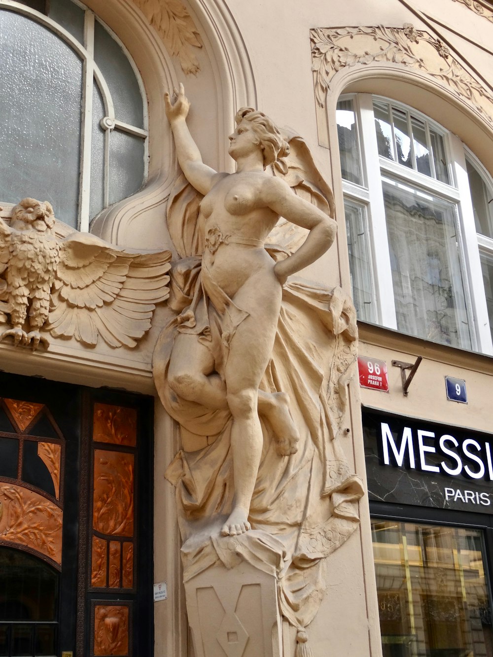 a statue on the side of a building