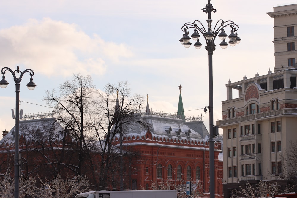 a street light with a building in the background