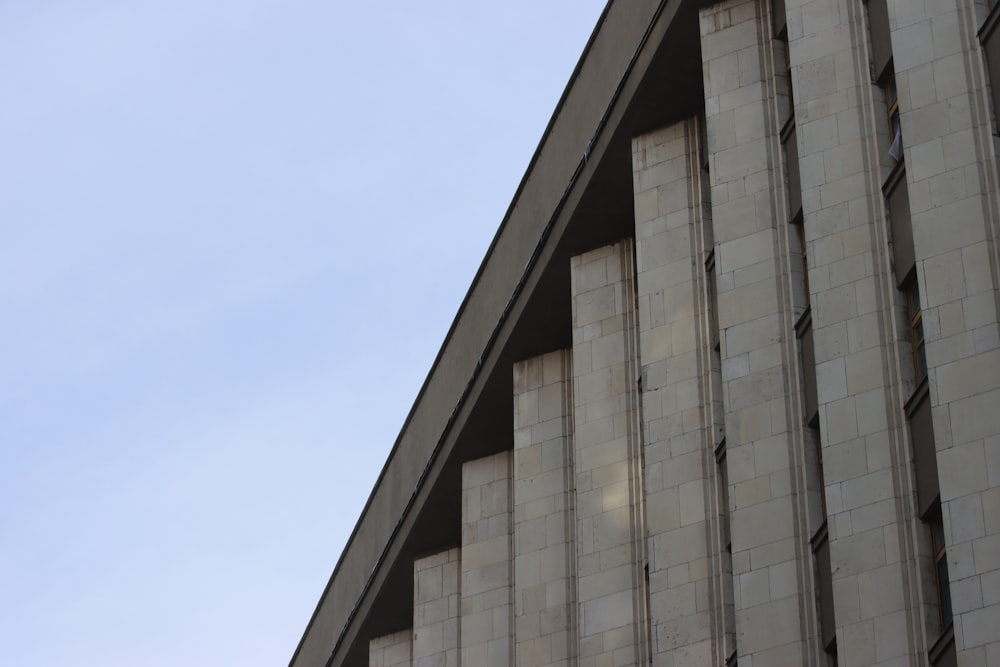 a clock on the side of a tall building