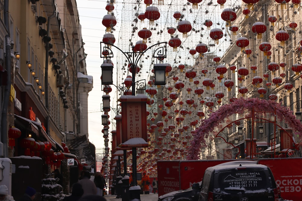 a city street filled with lots of red lanterns