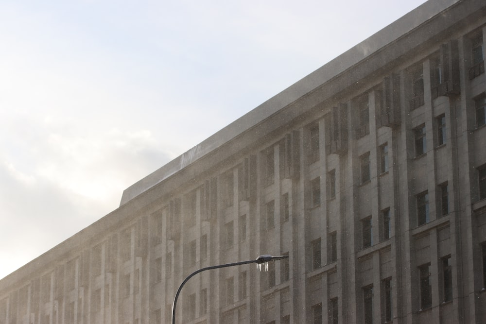 a tall building with a street light in front of it