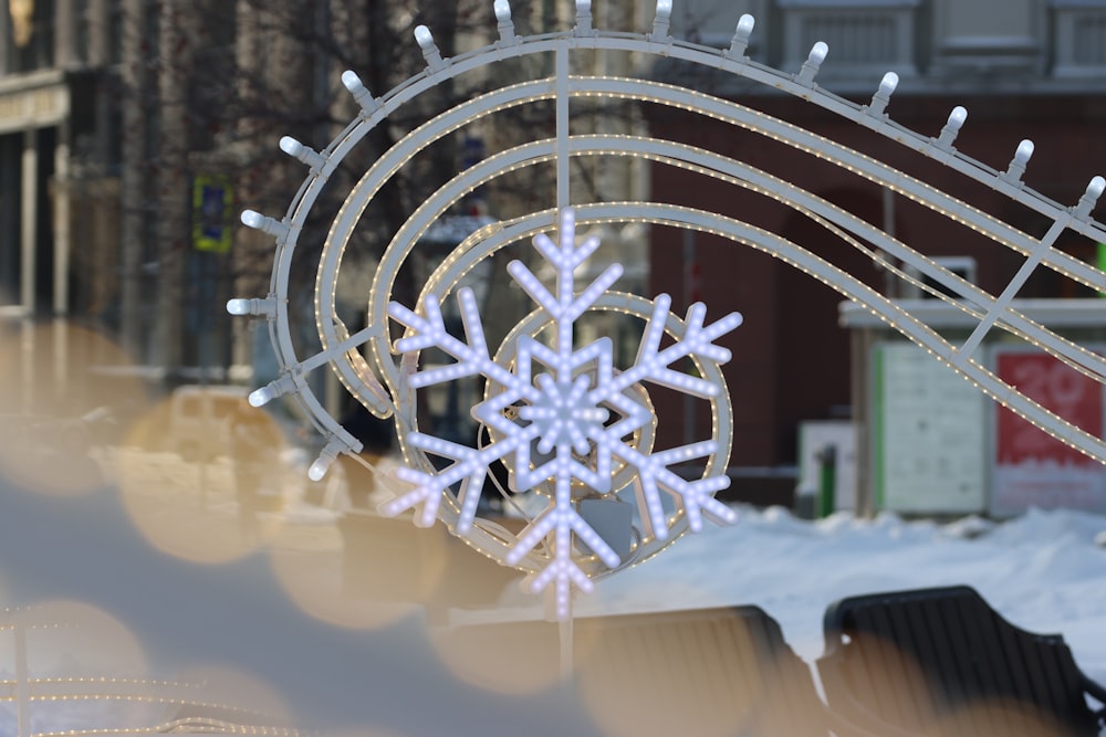 a snowflake hanging from the side of a building