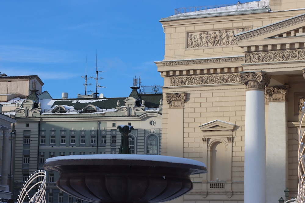 a water fountain in front of a building