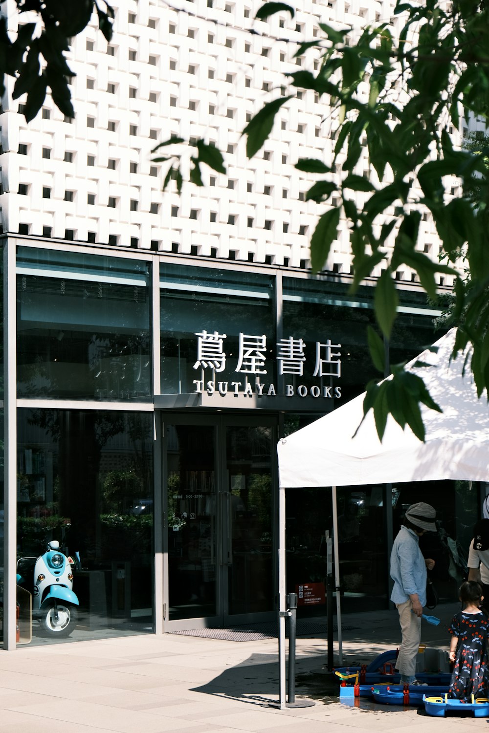 a group of people standing outside of a building