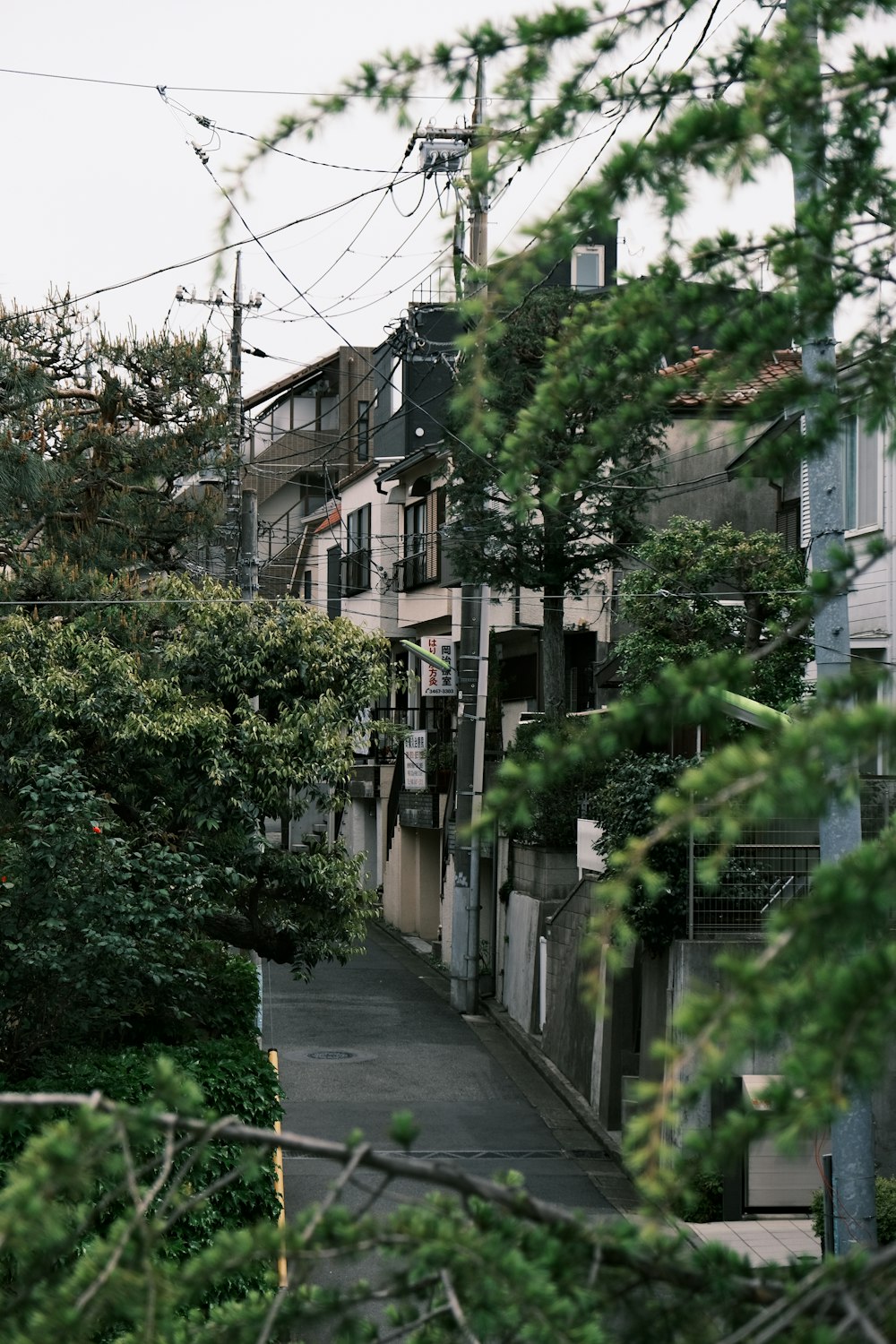 a view of a street with a clock tower in the background