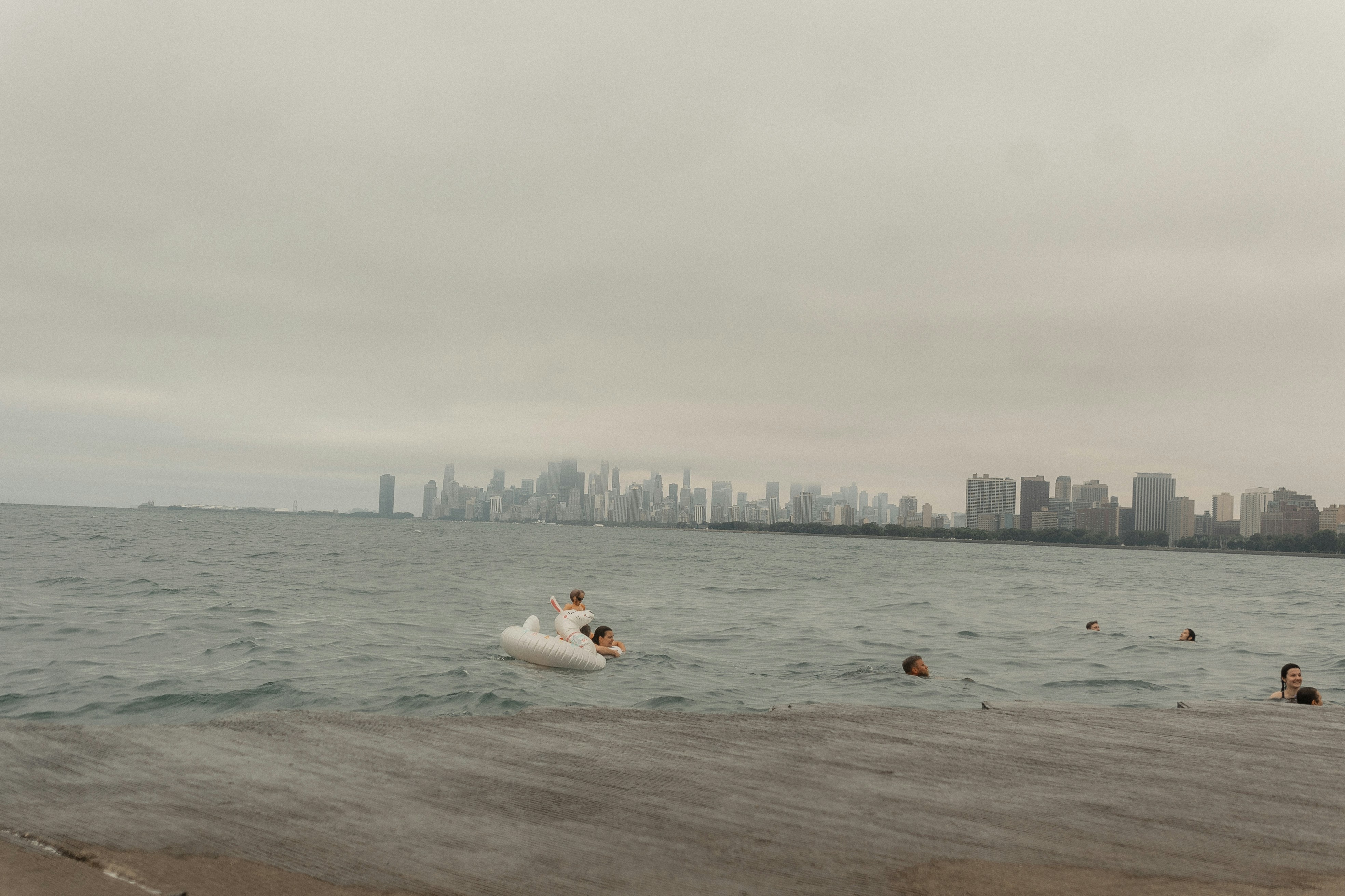 a group of people swimming in a body of water