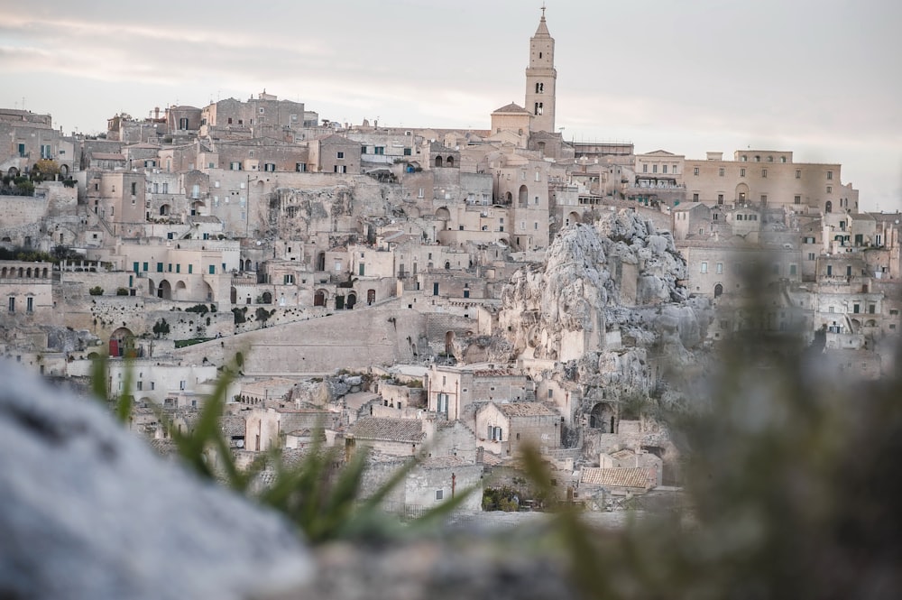 a view of a city with a clock tower in the background