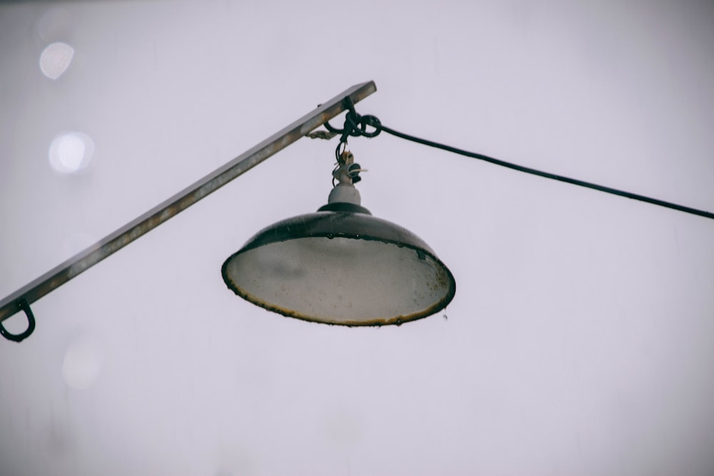 a street light hanging off the side of a pole