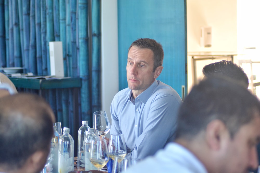 a man sitting at a table in a restaurant