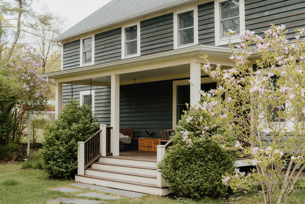 a house with a porch and steps leading to the front door