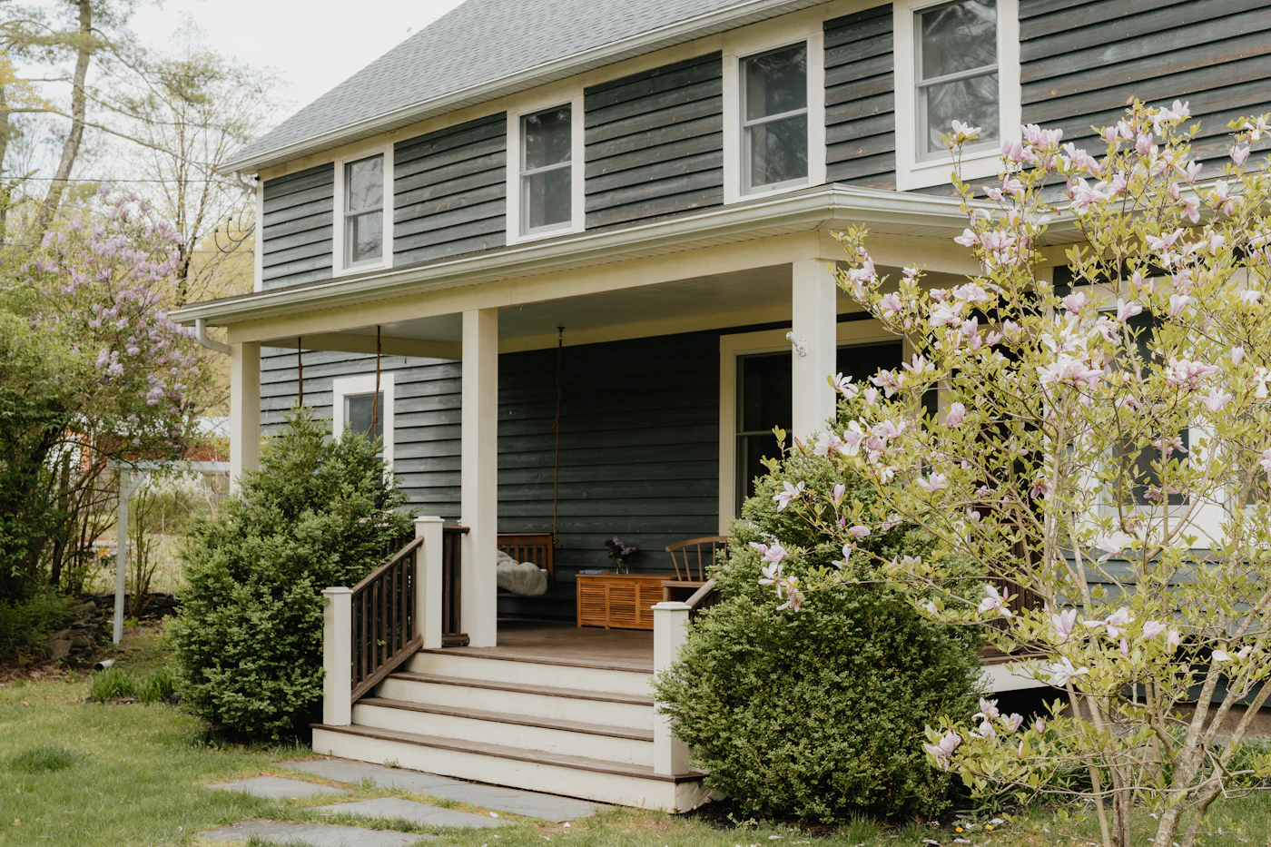 Timber Queensland home with a veranda and front steps leading up to the door