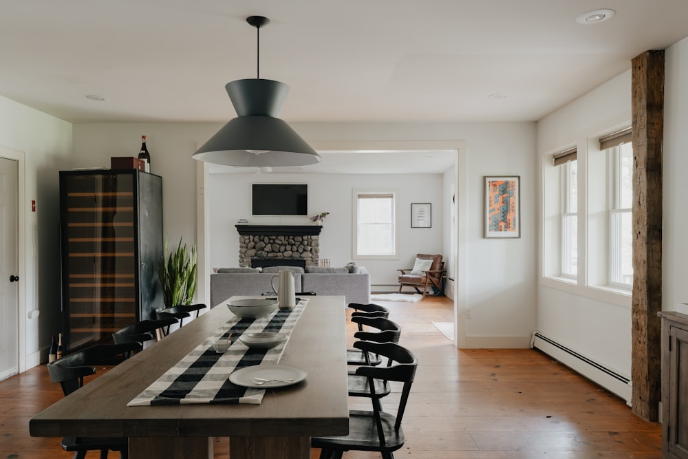 a dining room table with a black and white striped runner