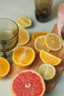 grapefruit, lime, and orange slices on a cutting board