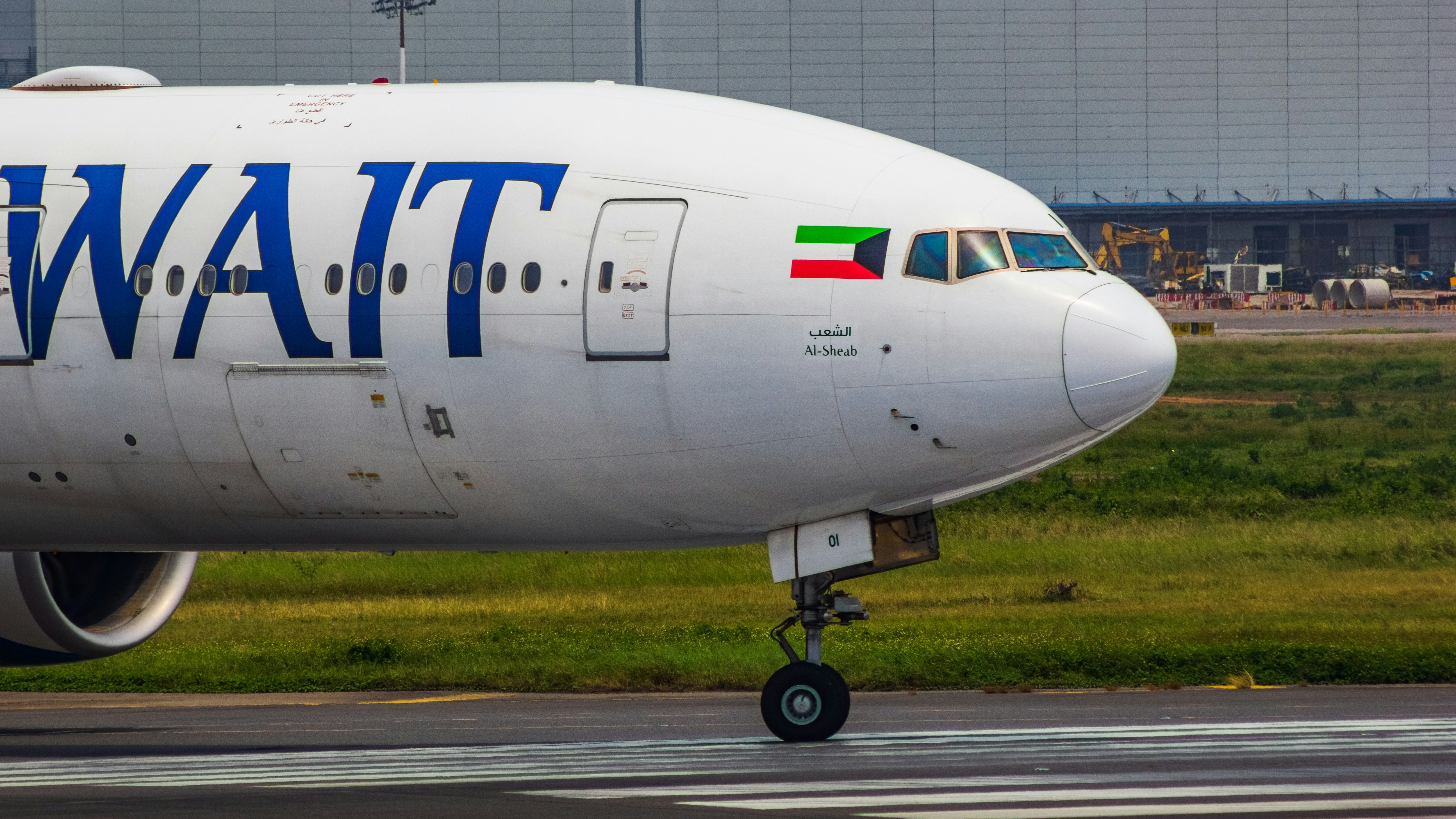 a large jetliner sitting on top of an airport runway, Kuwait 777 Preparing to Depart from Bangladesh!