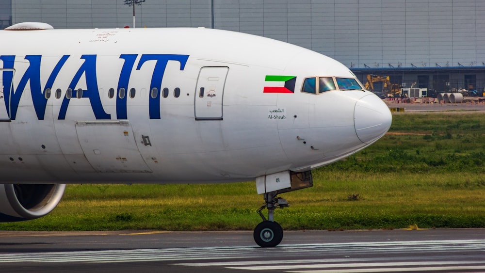 a large jetliner sitting on top of an airport runway