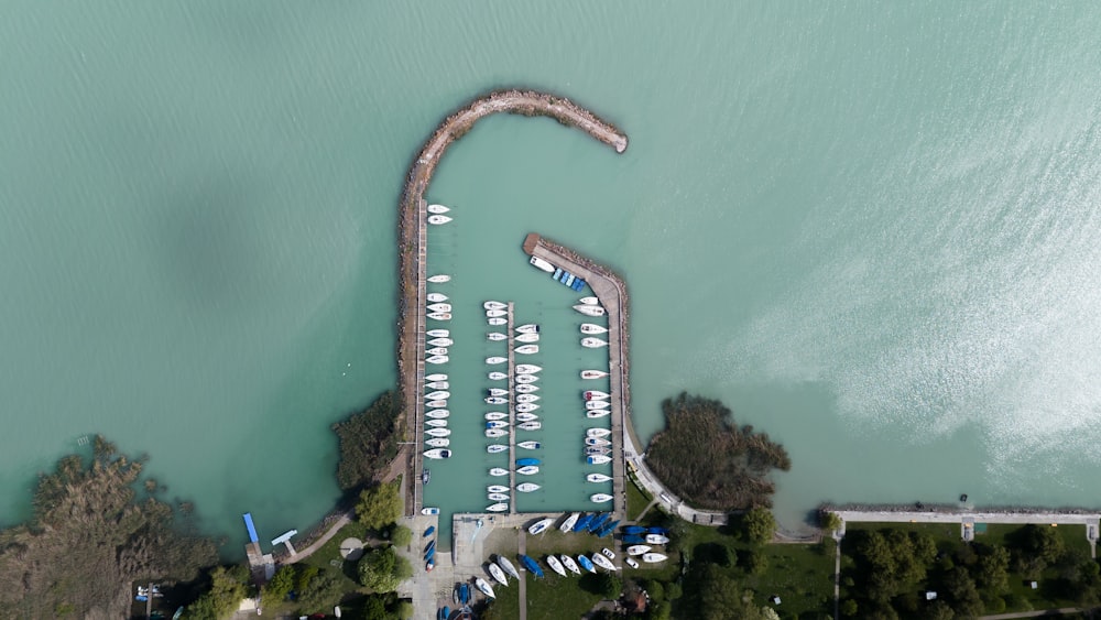 an aerial view of a marina with boats