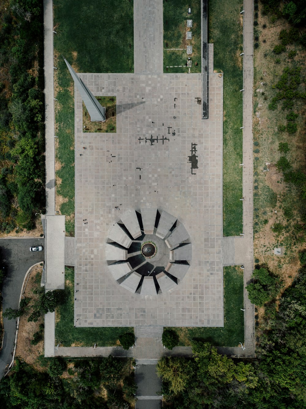 an aerial view of a park with a clock tower