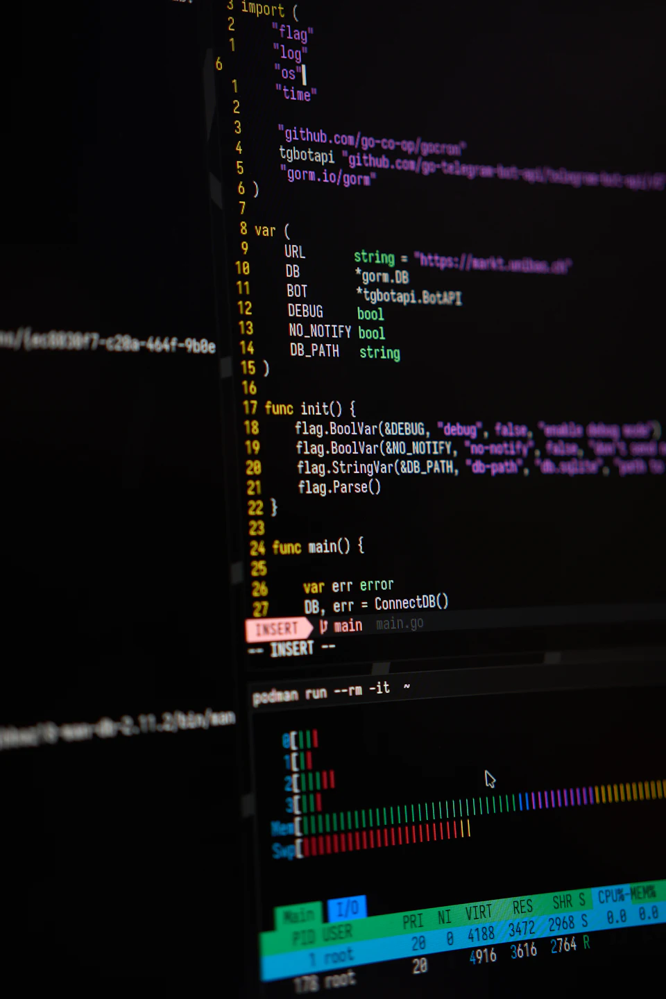 Close-up of a developer's screen showing code in an editor alongside a live terminal process monitor